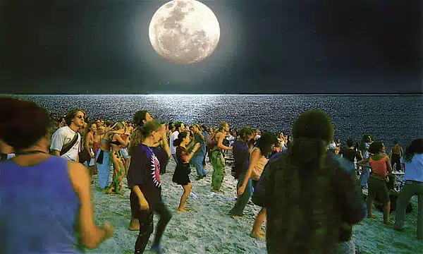 A Full Moon overlooking a Full Moon Party A Full Moon overlooking a Full Moon Party