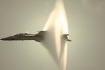 SUPER HORNET BREAKS SOUND BARRIER Here's a video of a plane breaking the sound barrier and making that super cool cloud vapour (which apparently has nothing to do with breaking the sound barrier) over a crowded beach.