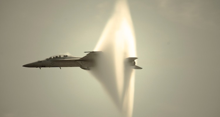 Here's a video of a plane breaking the sound barrier and making that super cool cloud vapour (which apparently has nothing to do with breaking the sound barrier) over a crowded beach.