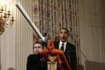 OBAMA FIRES MARSHMALLOW CANNON IN THE WHITEHOUSE The most powerful man in the world takes a break to try out a new air cannon that fires marshmallows.