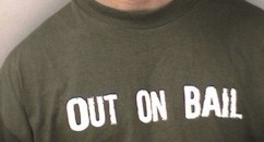 Top Ten Ironic T-Shirt Slogans In Mug Shots Balaclava, check. Gloves, check. Sawn off shotgun, check. Wait, where's my cheeky slogan t-shirt from TK Maxx?