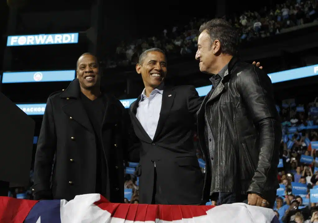 U.S. President Obama stands on stage with rapper Jay-Z and musician Springsteen at an election campaign rally in Columbus