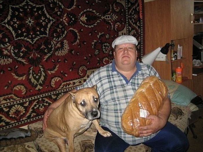 Hilarious Russian Photos - Big Man, Big Bread, Worried Dog