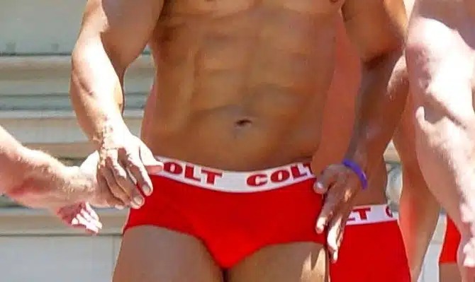 Muscular men in speedos