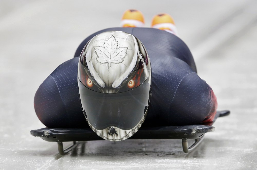 Canada's Neilson speeds down the track during a men's skeleton training session at the Sanki sliding center in Rosa Khutor, a venue for the Sochi 2014 Winter Olympics, near Sochi