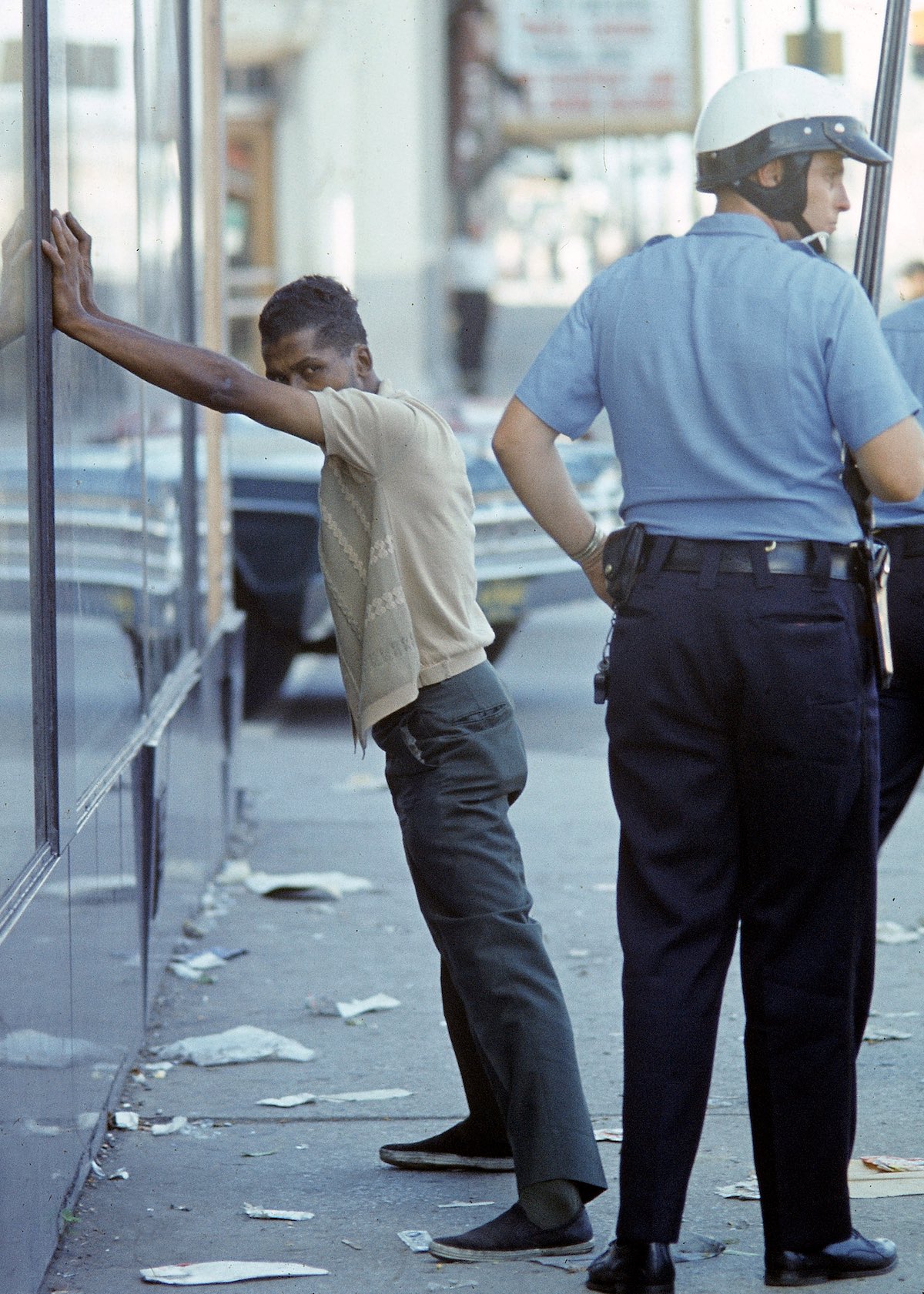 Policeman arresting an African American after race