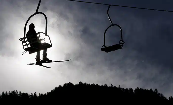 ASPEN, CO - NOVEMBER 24: A competitor heads up on the lift during FIS Women's Alpine World Cup Giant Slalom Training November 24, 2006 in Aspen, Colorado. (Photo by Doug Pensinger/Getty Images)