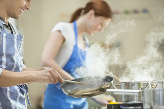 Couple cooking in kitchen