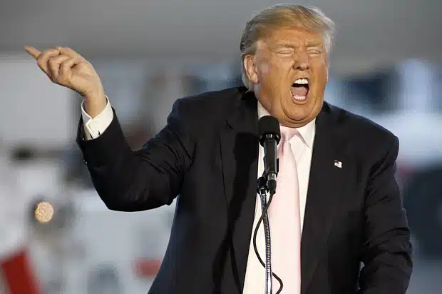 Republican presidential candidate, Donald Trump holds a plane-side rally at Youngstown-Warren Regional Airport in Vienna, Ohio, Monday, March 14, 2016. (AP Photo/Gene J. Puskar)