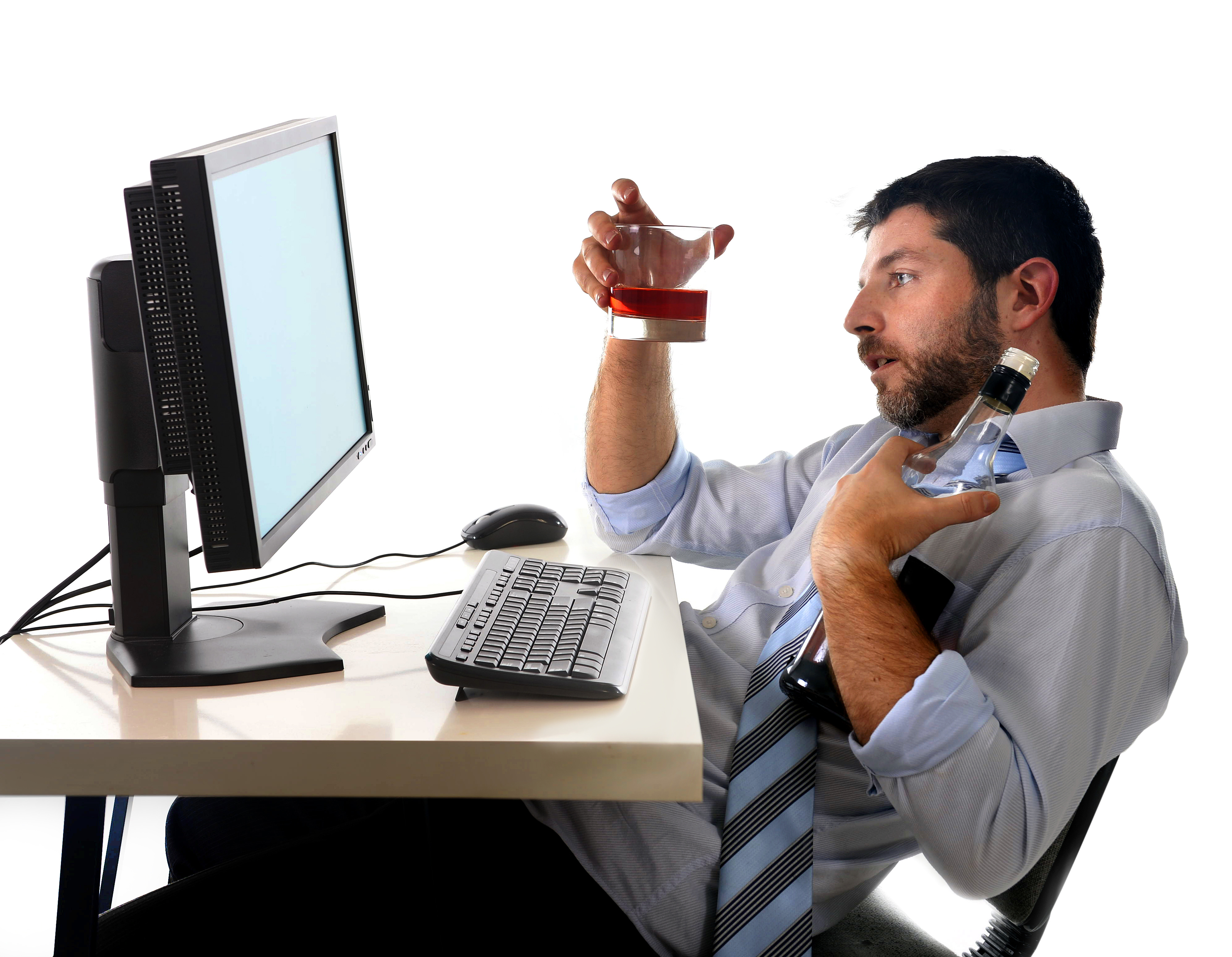 alcoholic business man sitting drunk at office with computer