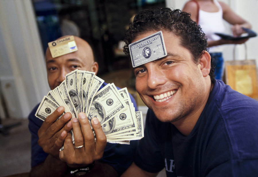 Film director and producer Brett Ratner (right), 29, and Russell Simmons, 41, a businessman and cofounder of hip-hop label Def Jam, at L’Iguane restaurant, St. Barts, 1998. Few establishments on the island accepted credit cards, and visitors often carried large amounts of cash.