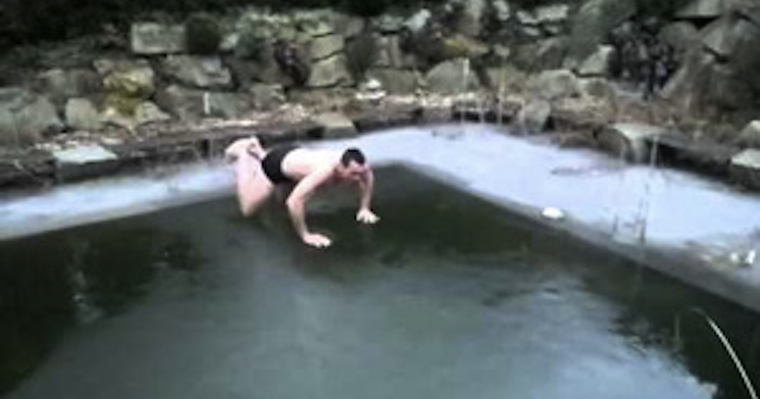 guy jumps into frozen pool