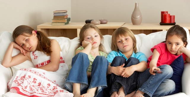 Young Children Watching Television at Home