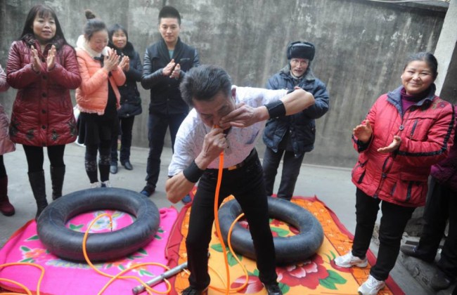 Weird News - Nie Yongbing Blow up tyres