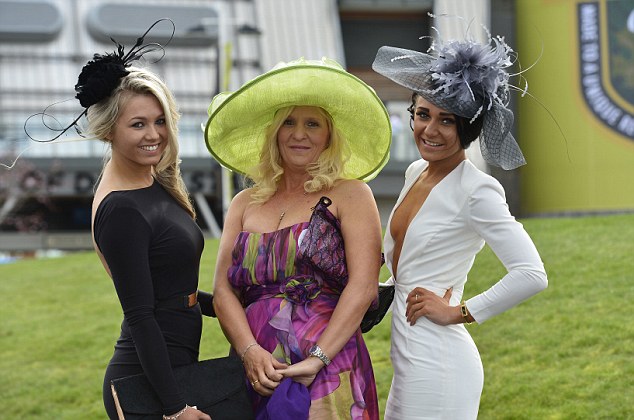 Pictured are mother and two daughters LtR: Georgia Newton, Paula Clarke and Katie Clarke at Ladies Day, Aintree Racecourse, The Crabbies Grand National