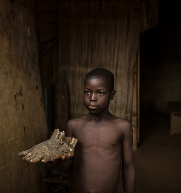 Akodessewa Voodoo Market Togo - boy with gorilla's foot