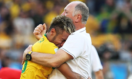 A crying Neymar is comforted by manager Luiz Felipe Scolari after Brazil beat Chile in the World Cup
