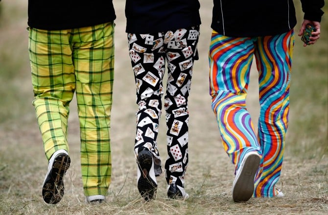 Image: Spectators walk during the final practice round for the British Open golf championship at Royal St George's in Sandwich