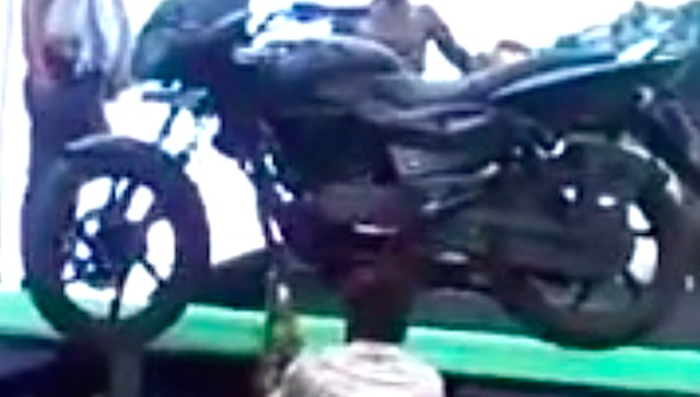 Motorcycle Balanced On Head By Indian Guy