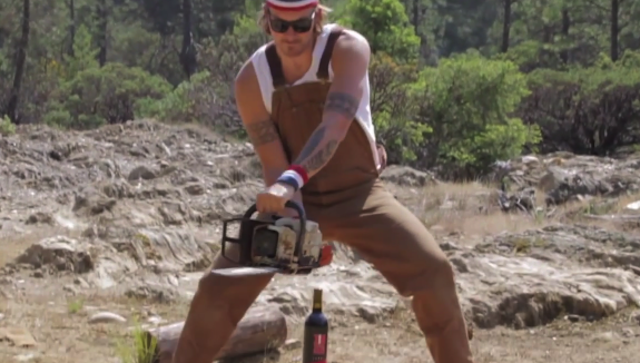 Man Opens Bottle With Chainsaw