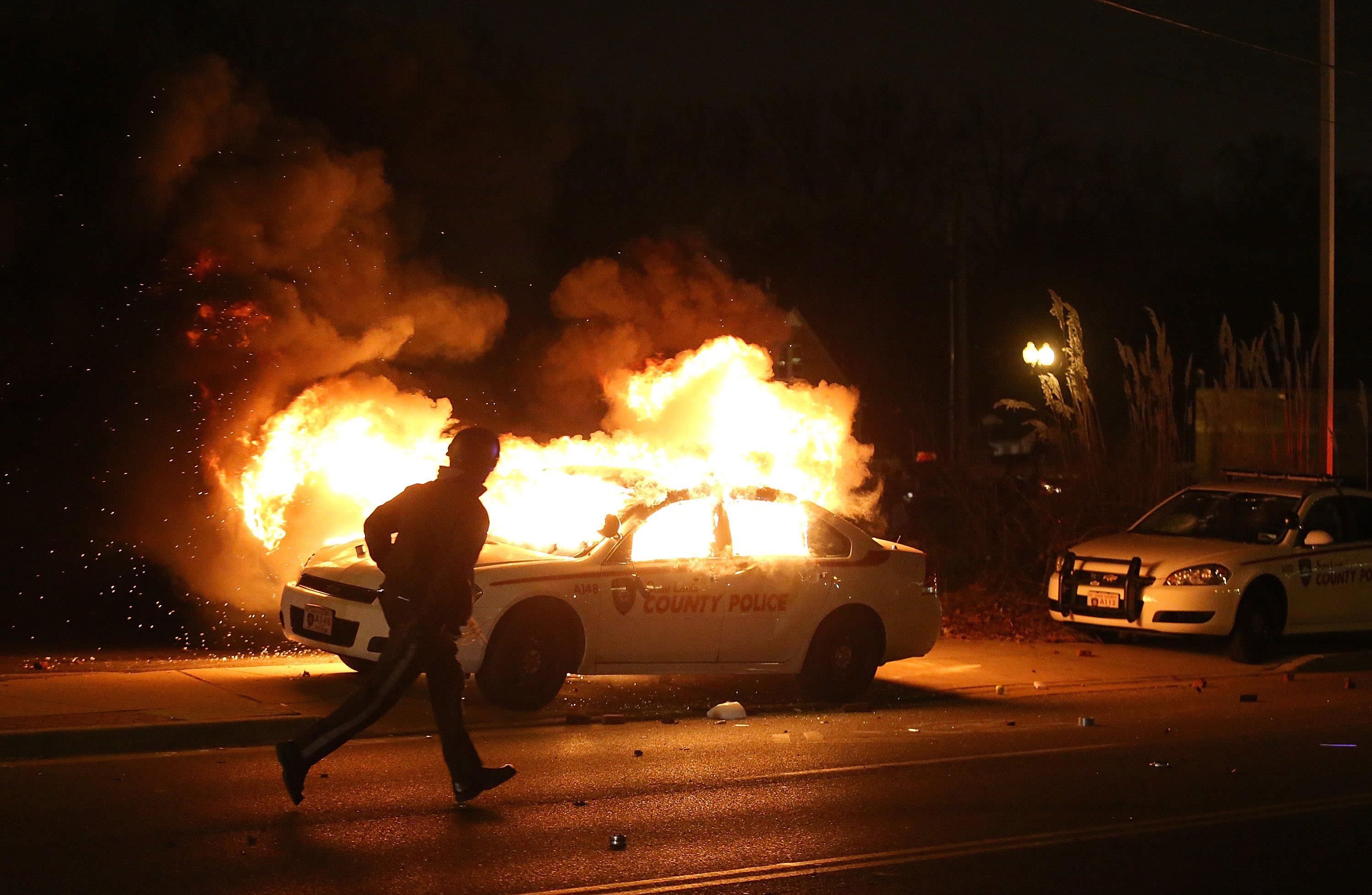 police car fires in ferguson