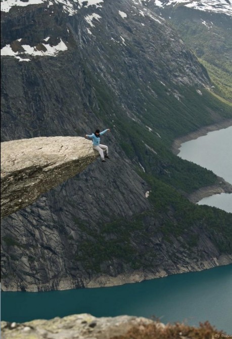 Acrophobia - Sitting on the Trolltunga rock in Norway