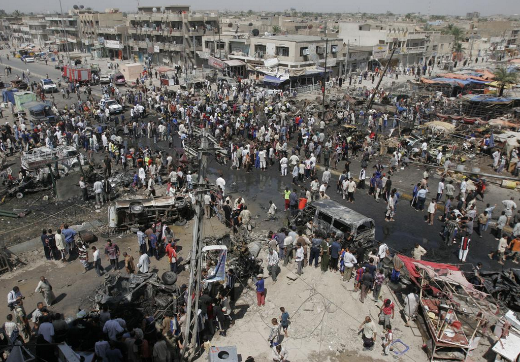 Iraq War In Pictures - Car Bomb Scene Crowd