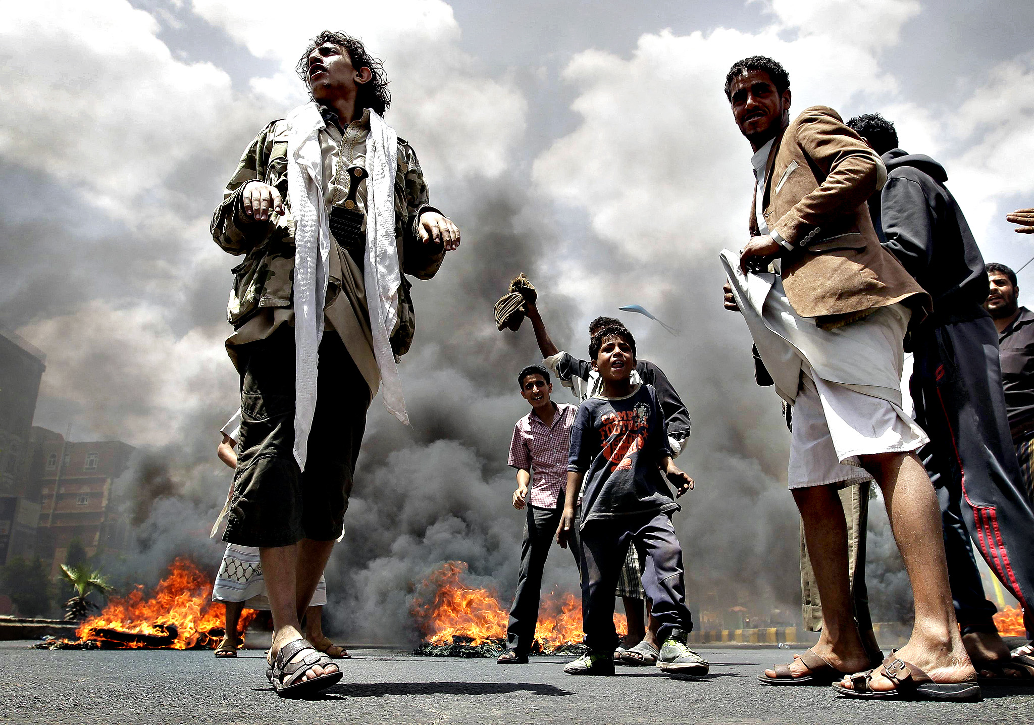 Protesters burn tyres during a demonstration against against Yem