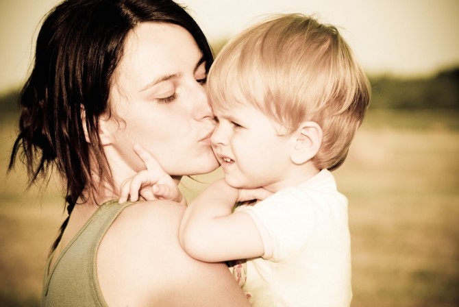 Woman Holding New Baby