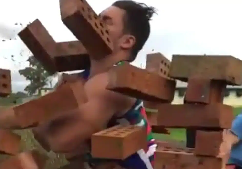 Rugby Player Runs Through Brick Wall