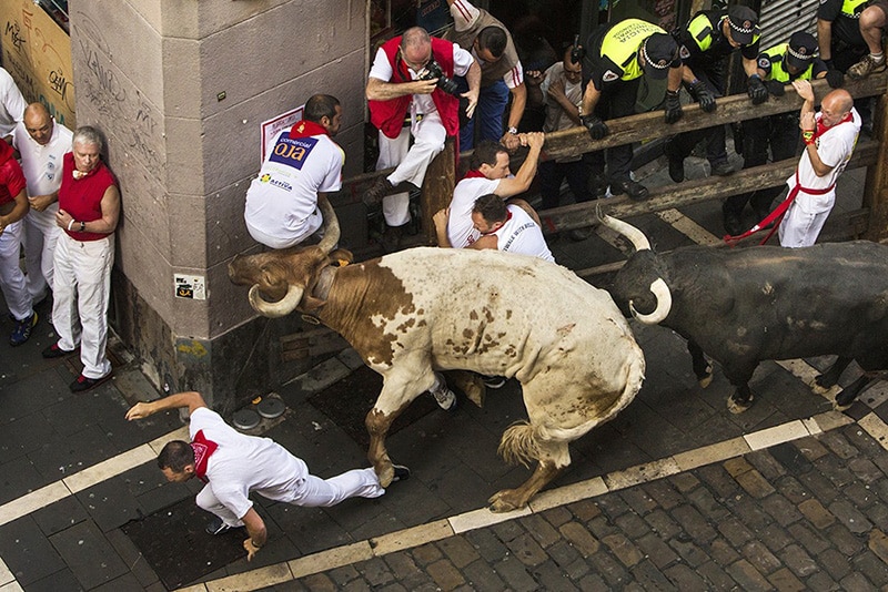 We Can’t Get Enough Of These Photos Of Humans Getting Annihilated At The 2015 Running Of The Bulls