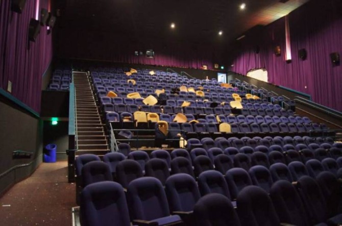 This July 2012 evidence photo, which the Arapahoe County District Attorney's Office released in response to open-records requests, shows the Colorado movie theater with bullet holes following the July 20, attack by James Holmes in Aurora, Colo. In August 2015, Holmes was sentenced to life in prison because jurors could not agree that he deserved the death penalty. (Arapahoe County District Attorney's Office via AP)