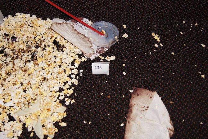 This July 2012 evidence photo, which the Arapahoe County District Attorney's Office released in response to open-records requests shows, bloody napkins and overturned popcorn inside the Colorado movie theater following the July 20, attack by shooter James Holmes, in Aurora, Colo. In August 2015, Holmes was sentenced to life in prison because jurors could not agree that he deserved the death penalty. (Arapahoe County District Attorney's Office via AP)