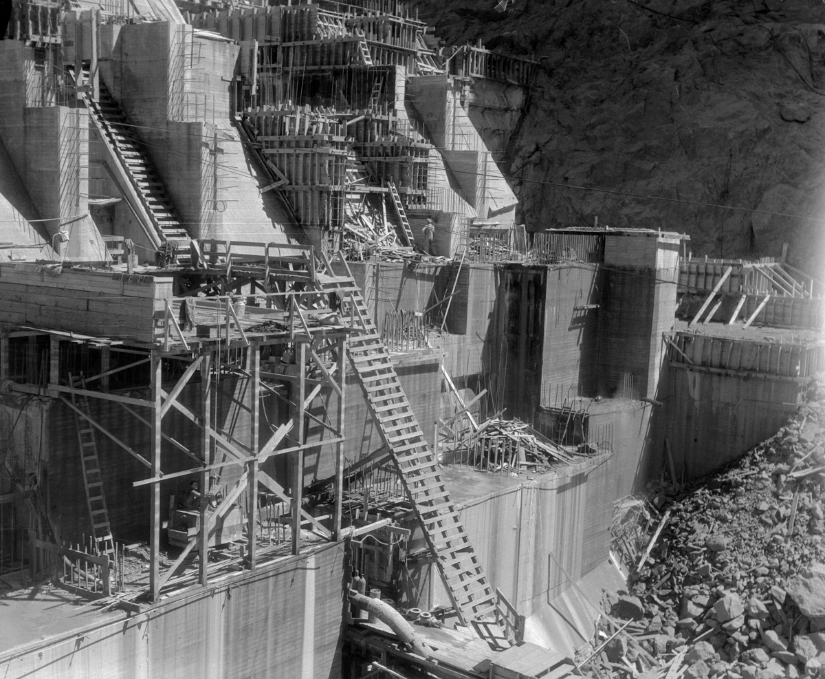 19 Sep 1933, Boulder, Colorado, USA --- Original caption: At Boulder Dam. Mayor Frank L. Shaw of Los Angeles and a party of newspapermen returned recently from a three day inspection tour of Boulder Dam and construction camps along the route of the city's $22,800,000 electric transmission line. The line will extend from Los Angeles to the Boulder Dam power plant on the Colorado River. This photo shows a close up view of the dam construction. --- Image by © Bettmann/CORBIS
