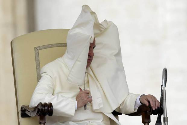 A gust of wind blows Pope Francis' mantle during the weekly general audience in St. Peter's Square at the Vatican, Wednesday, Sept. 16, 2015. (AP Photo/Gregorio Borgia)
