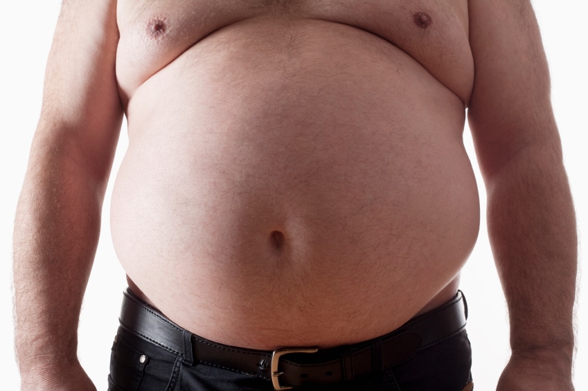 big belly of a fat man isolated on white