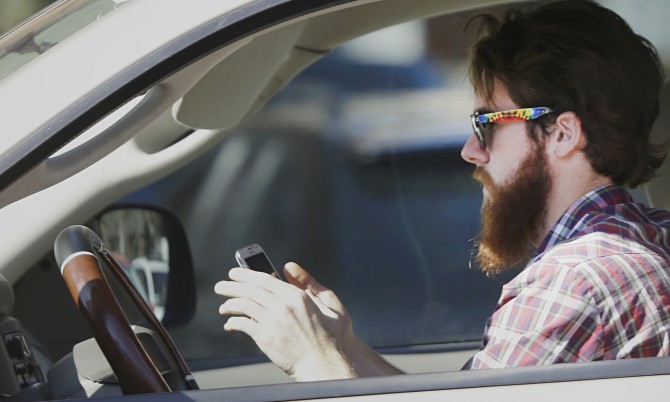 Man texting while driving