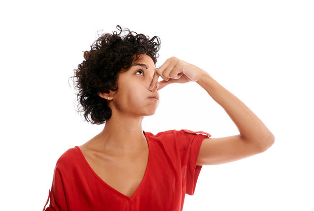 hispanic young woman holding breath