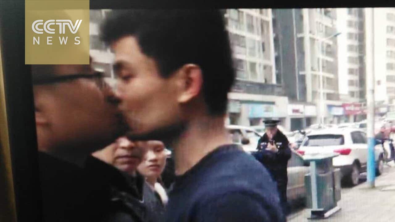 Chinese Dude Kisses Angry Policeman On The Lips, Proceeds To Get Battered