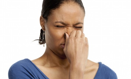 Woman Holding Nose