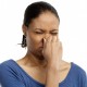 Woman Holding Nose