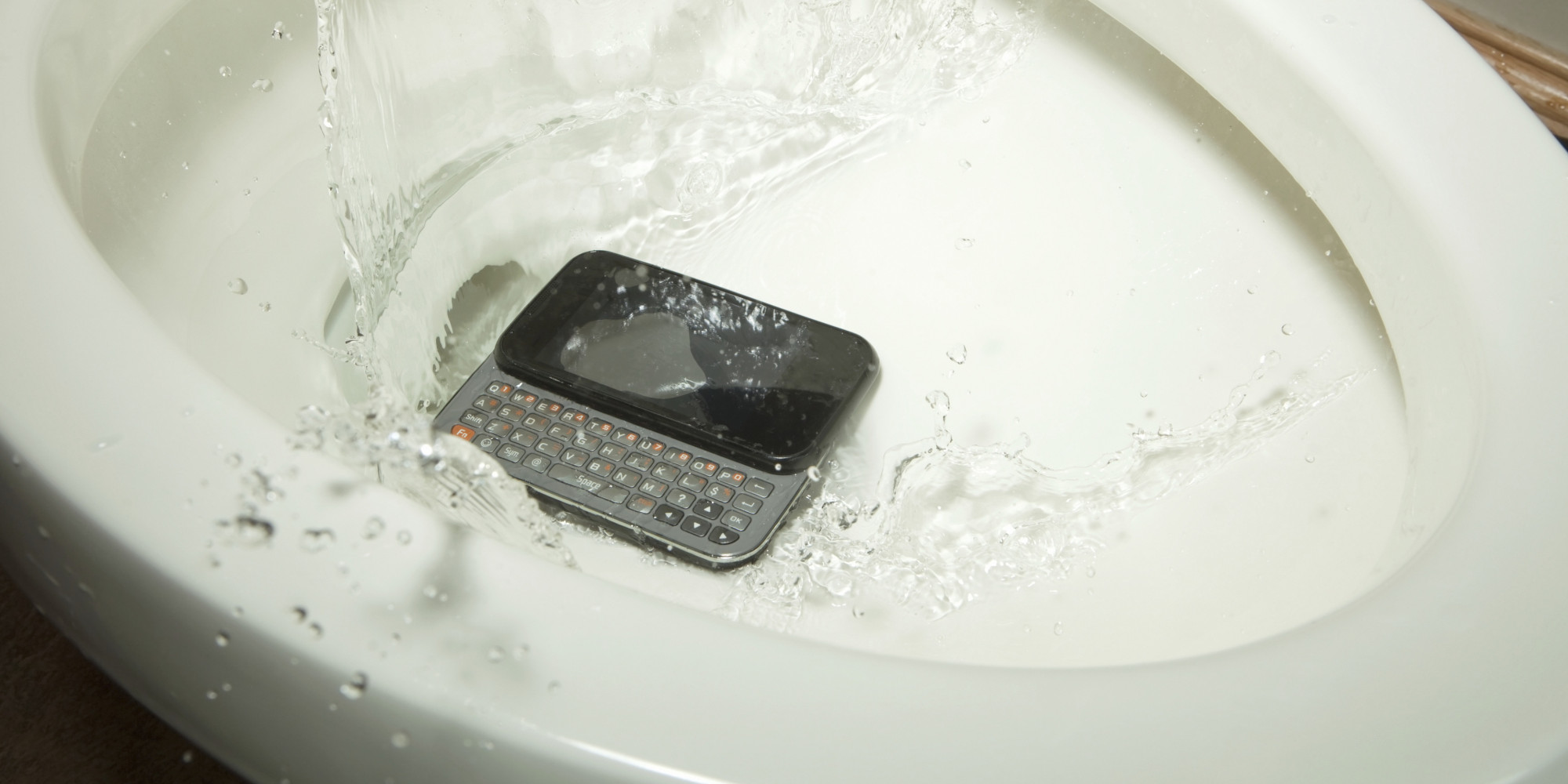 Mobile Phone Drops into a Toilet