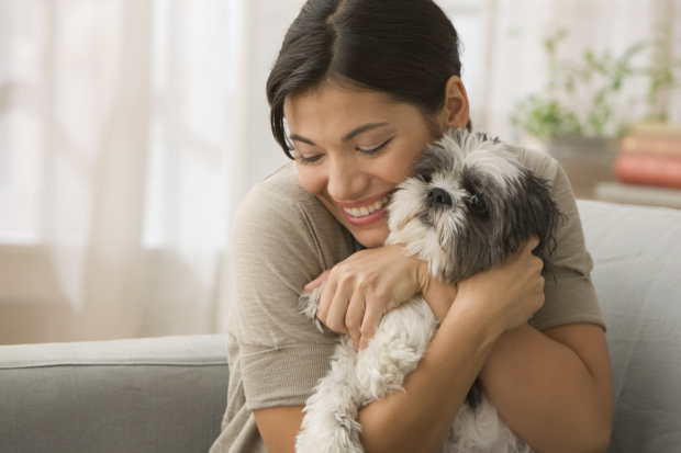 Young Woman hugging dog