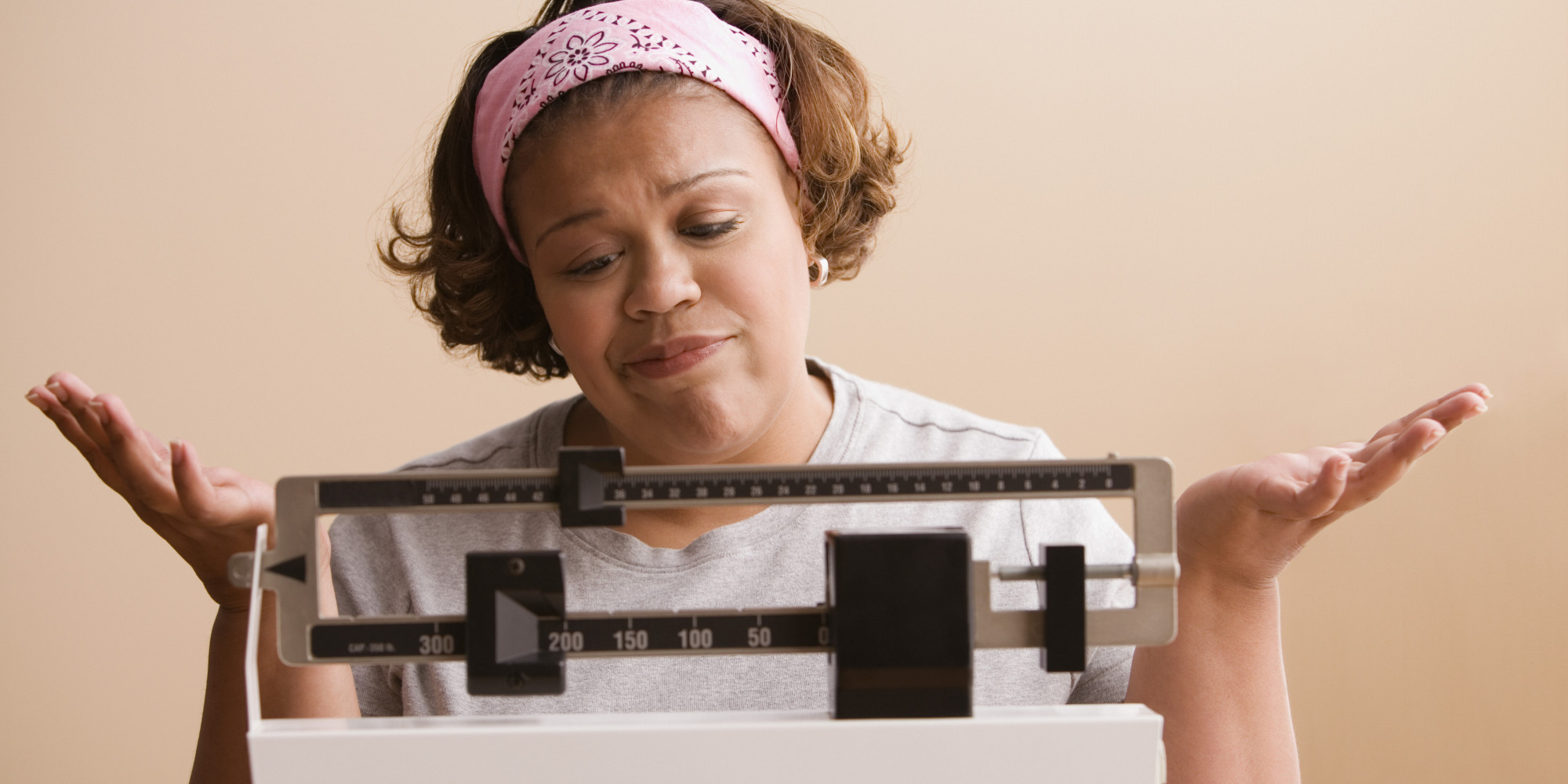 Woman weighing herself