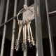 Jail Cell With Open Door And Bunch Of Keys