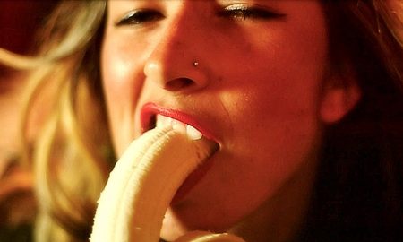 Woman eating banana