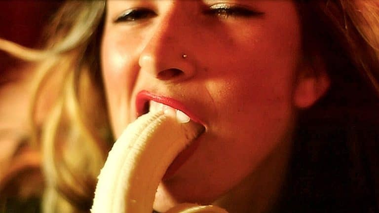 Woman eating banana