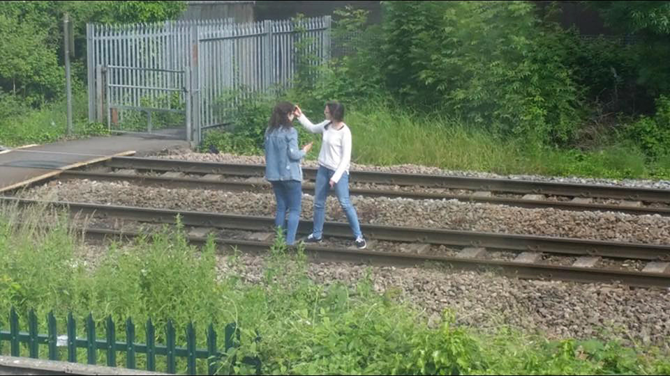 teen girls train track selfie