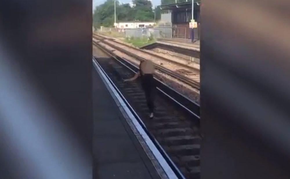 Woman on train tracks