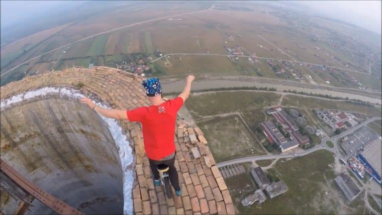 This Guy Riding A Unicycle On The Edge Of A 840-Foot Chimney Needs His Head Examined (VIDEO)